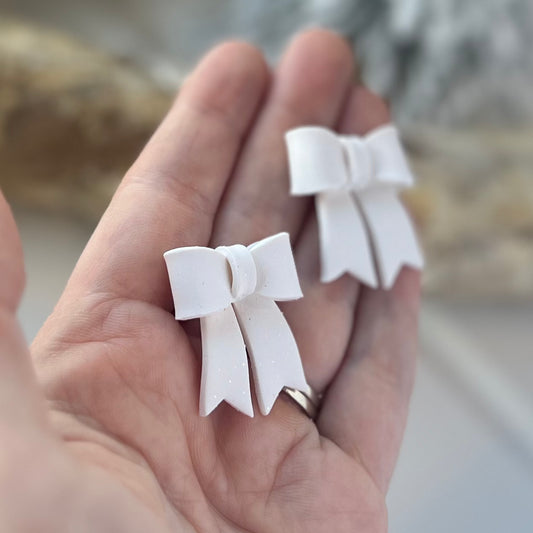 Frosted Bow Statement Studs