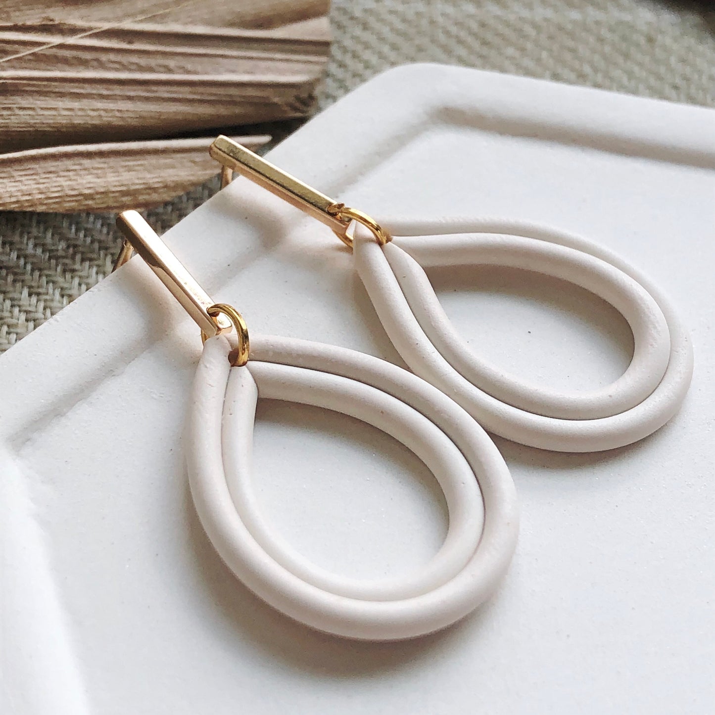 Piped Teardrop Dangles in Cream